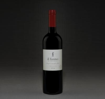 Bottle of red wine against a dark background