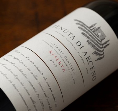 Single bottle of red wine against a dark background