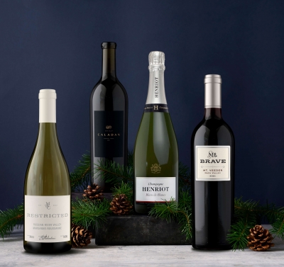 Collection of wine bottles against a navy bottle