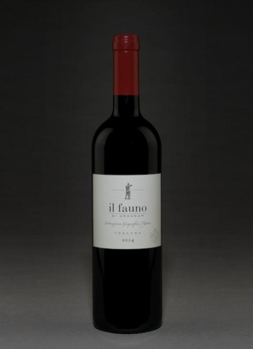 Bottle of red wine against a dark background