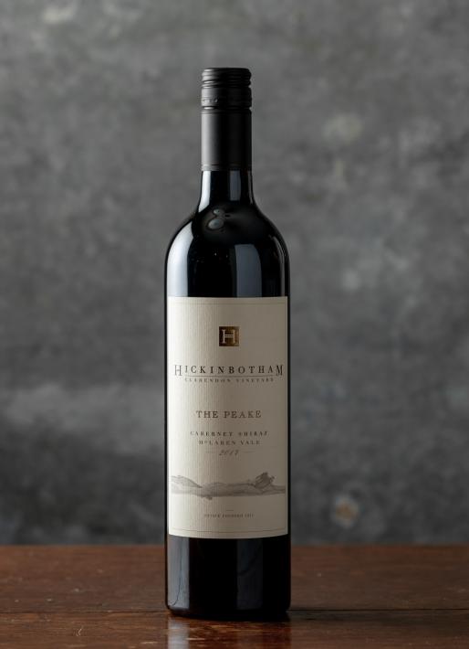 Bottle of red wine against a dark background