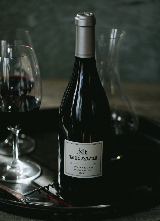 Single bottle of red wine against a dark background