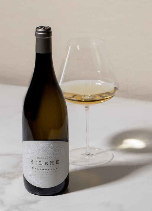 Single bottle of wine against a white background