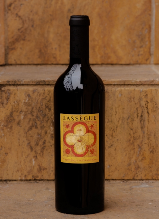 Single bottle of red wine against a tile background