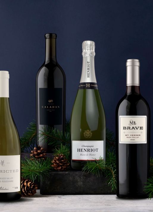 Collection of wine bottles against a navy bottle